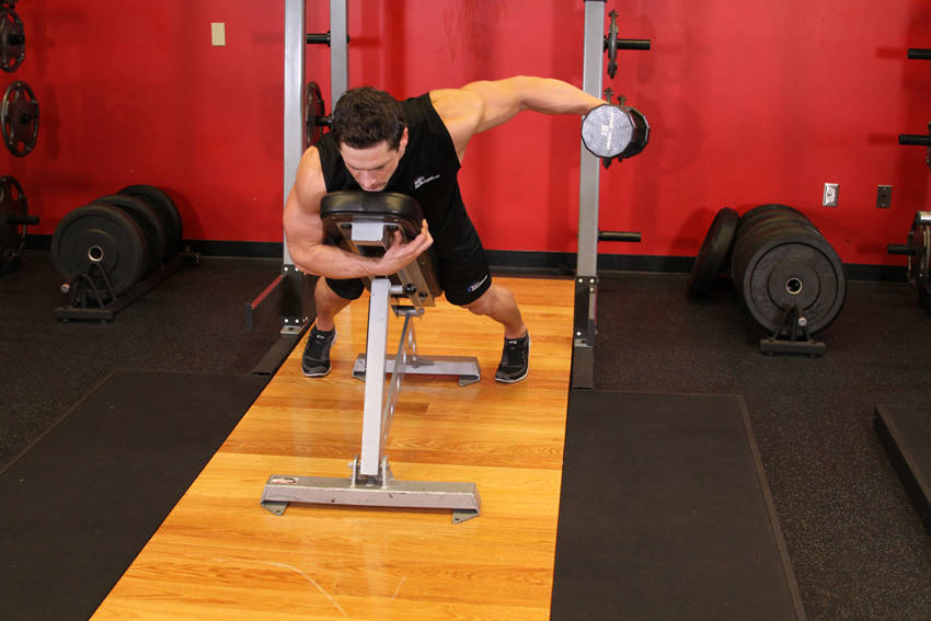 Dumbbell Lying One-Arm Rear Lateral Raise — End position
