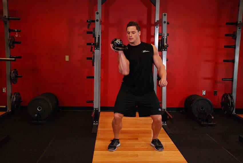 One-Arm Open Palm Kettlebell Clean — End position