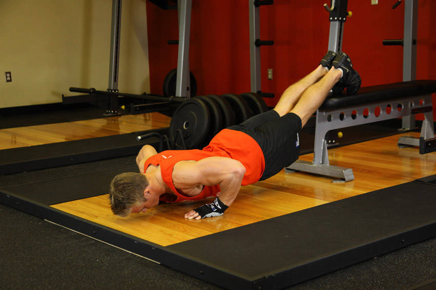 Push-Ups With Feet Elevated — End position