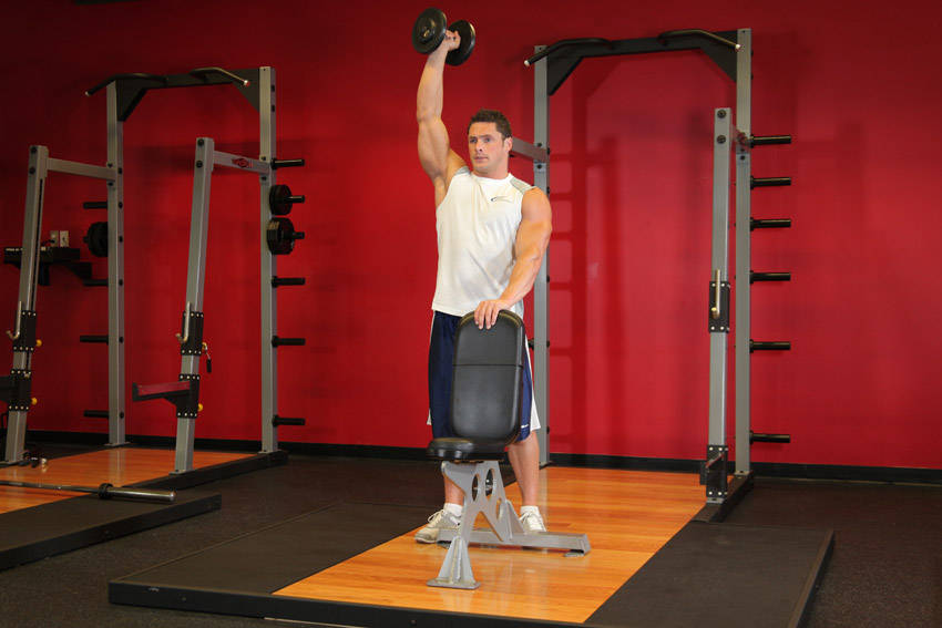 Standing Palm-In One-Arm Dumbbell Press — End position