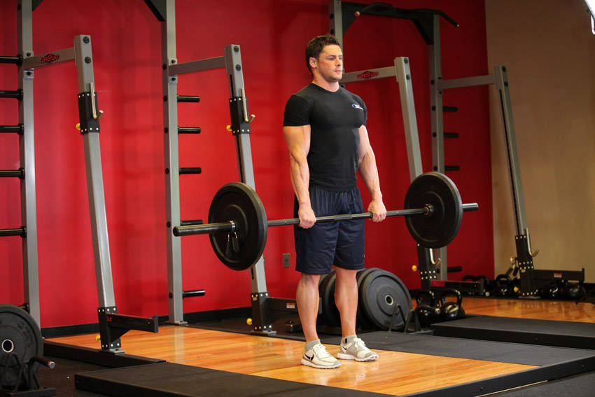 Stiff-Legged Barbell Deadlift — End position