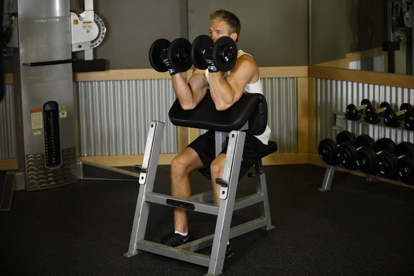 Two-Arm Dumbbell Preacher Curl — End position